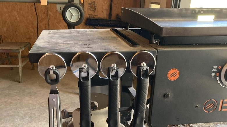 Pittsburgh's 65-pound Magnetic Decor Hooks on a grill holding utensils