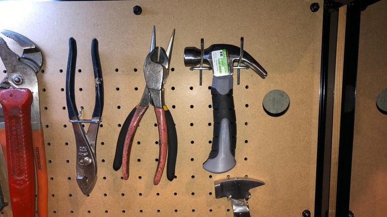 Pittsburgh's 8-ounce Stubby Claw Hammer hanging on a pegboard