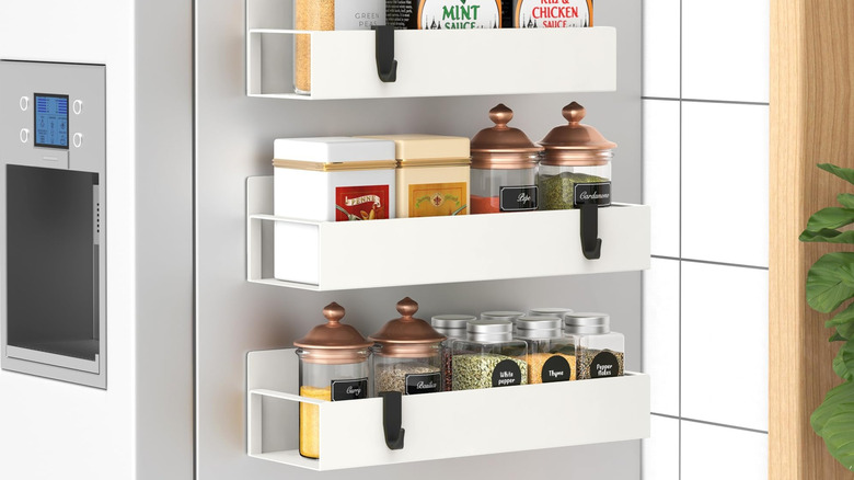A magentic HuggieGems spice rack on a fridge