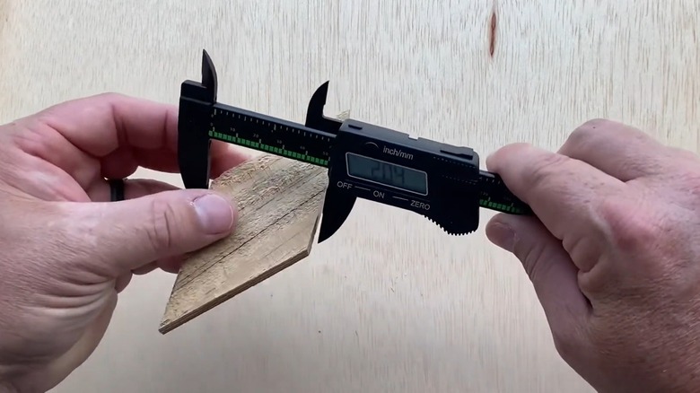 Person using a Pittsburgh digital caliper to take a measurement