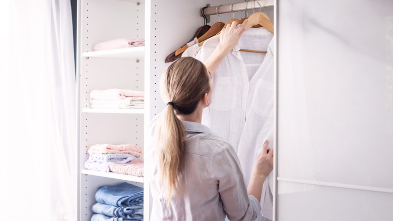 Woman organizing her closet