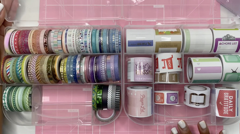 Two plastic compartment cases used for crafting supplies.