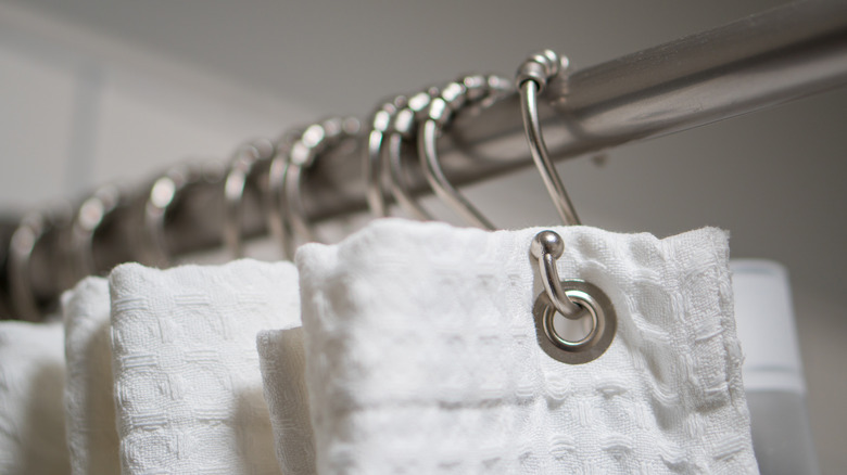 shower curtain hooked to rod 
