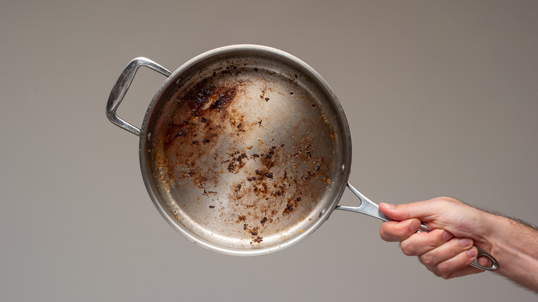 Saucepan with burnt, stuck food