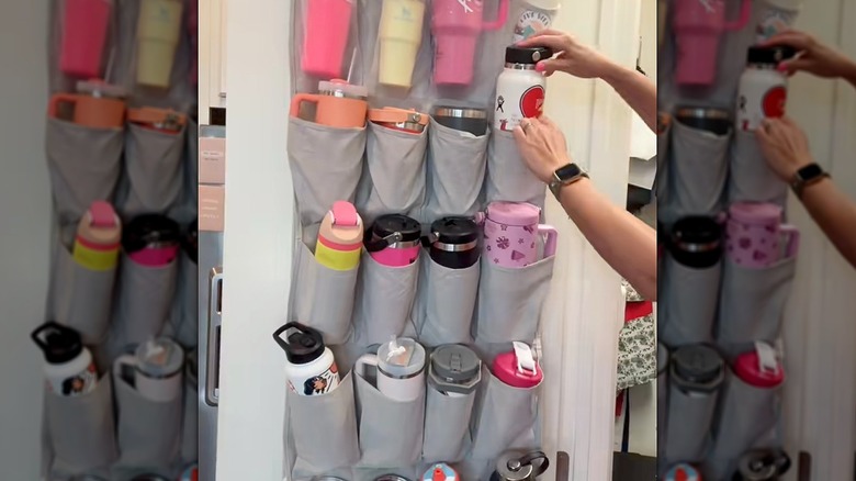 An over-the-door shoe organizer filled with reusable bottles