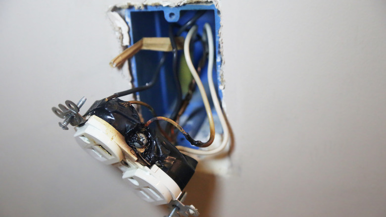burned wires behind outlet