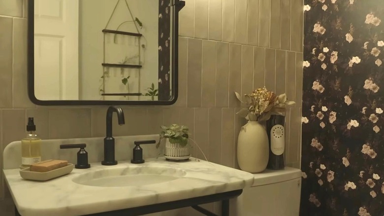 Lyndsay Lamb standing in a small bathroom.
