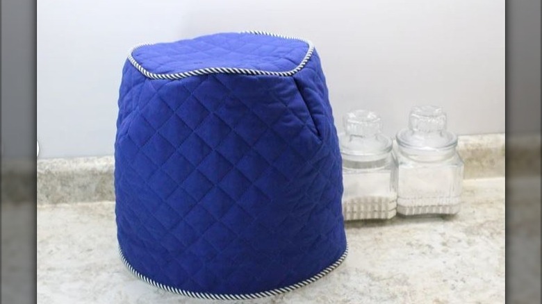 Air fryer covered by custom-made blue cover