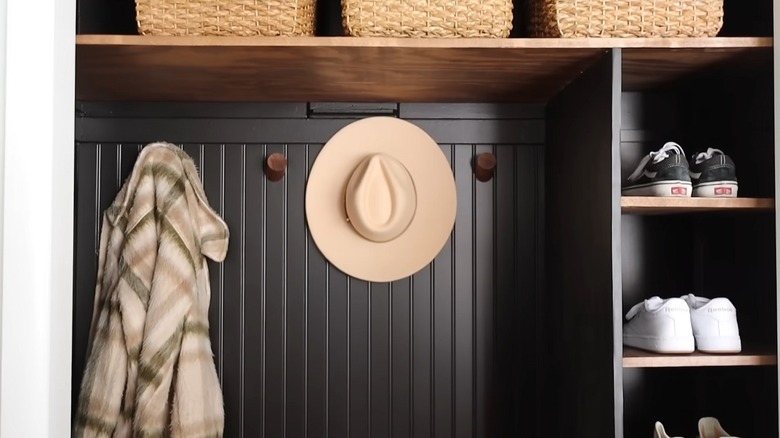 Converted entryway closet into storage with hooks and cubbies
