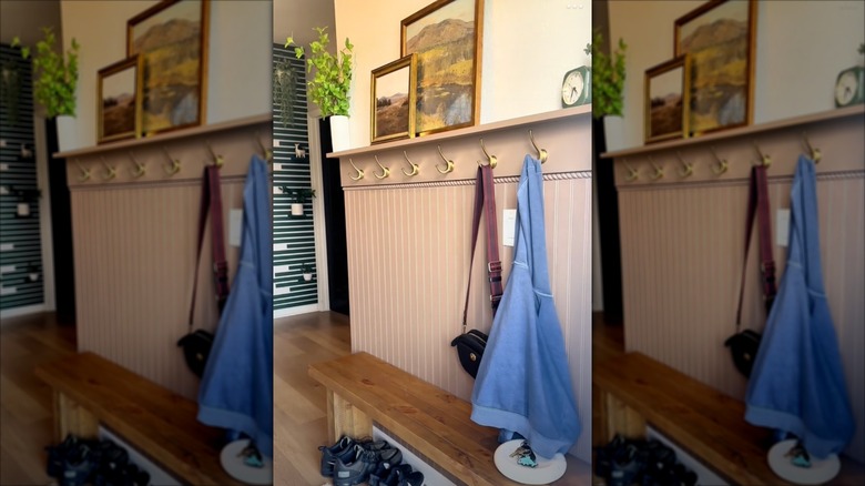 Video of woman DIYing a shelf and bench in her entryway