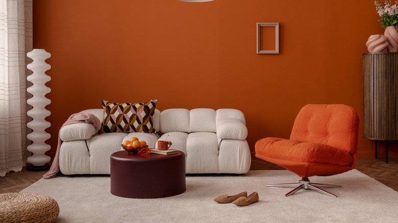 A cloud sofa in a futuristic living room with orange walls