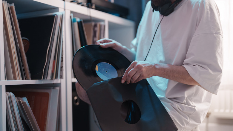 Person organizing vinyl collection