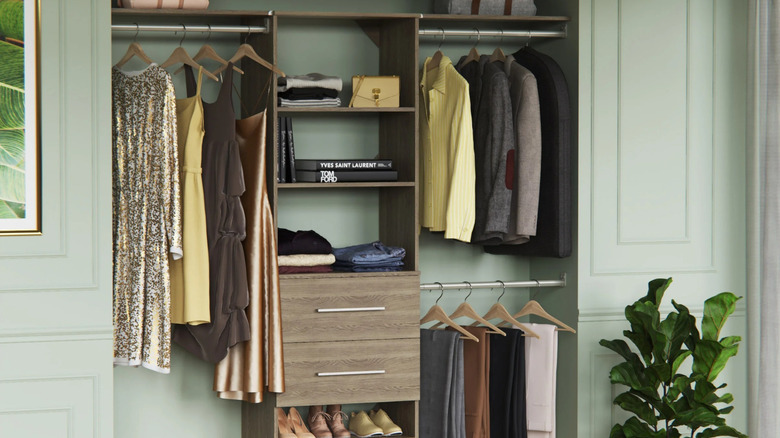 ClosetMaid SuiteSymphony closet organizer with hanging clothes, folded clothes, shoes, and accessories