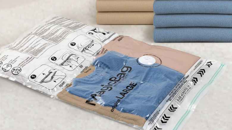 MagicBag vacuum bag with blue and tan sweaters inside