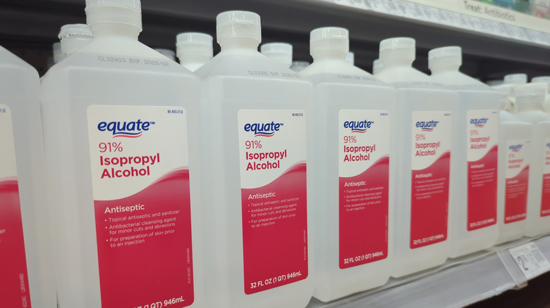 A shelf of rubbing alcohol bottles