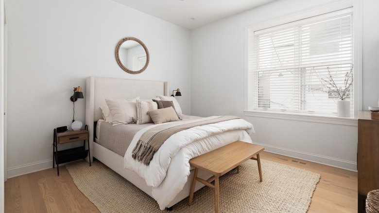 Bedroom with neutral colors and light wood floors