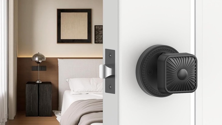 A square door knob on a bedroom door