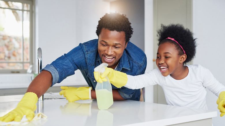 father and daughter house cleaning