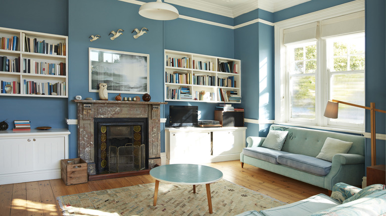 Cozy living room with blue walls and decor