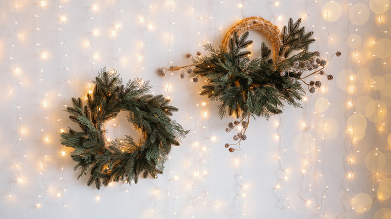 Two wreaths hanging on a wall