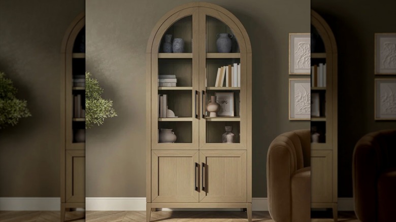 Abbyson Aspen Bookcase in a living room setting with various decorative items inside