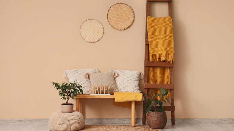 Blankets folded on a chair.