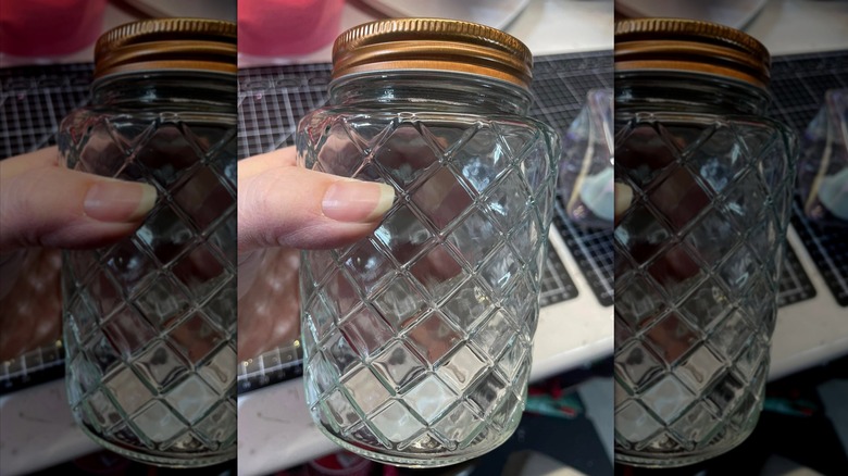 Closeup on Dollar Tree lattice pattern glass jar with rose gold metal lid