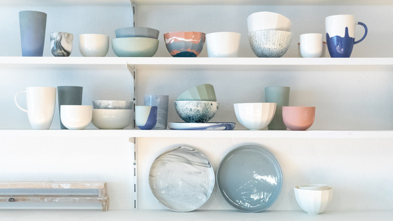 Mugs and dishware on shelves