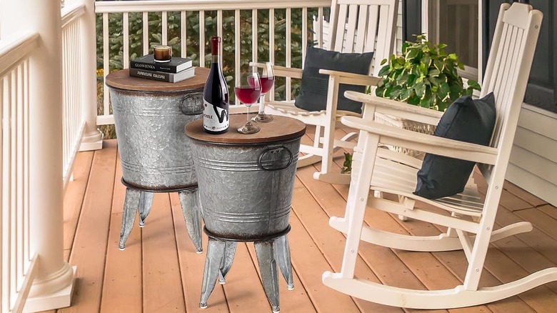 The RUSTOWN Farmhouse Side Tables Set of 2 displayed outside on a porch