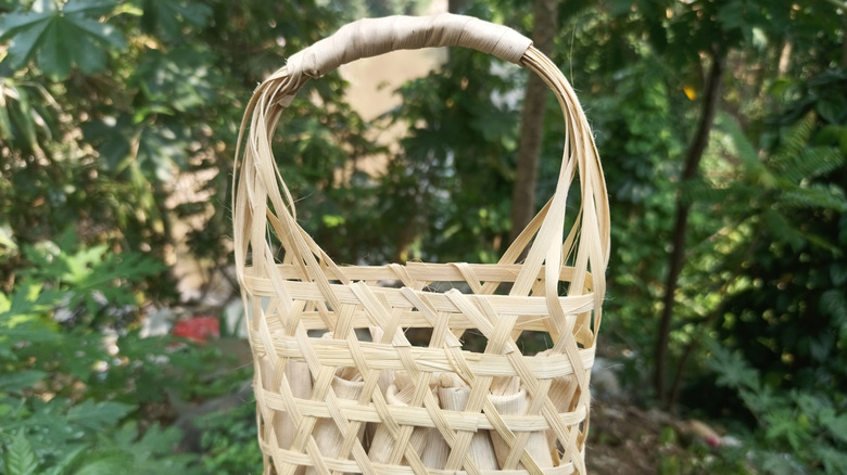 Close up of bamboo and corn husk woven basket