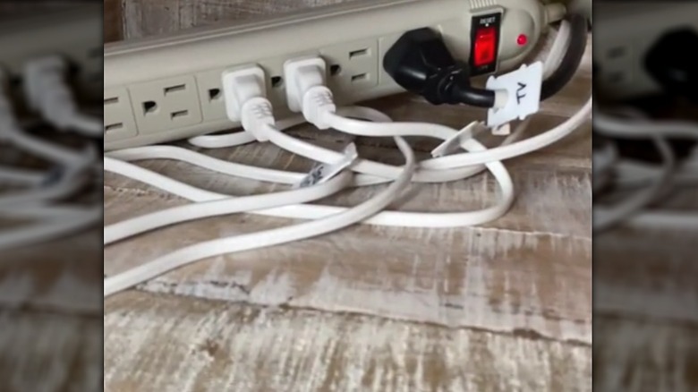 Power strip with each cord labeled by a bread tag