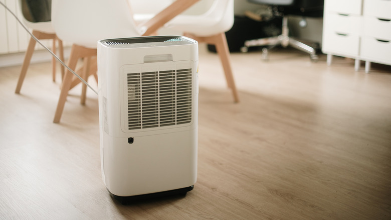 a dehumidifier used near wooden furniture