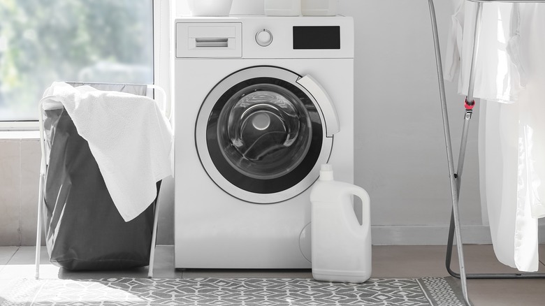 laundry hamper next to washer