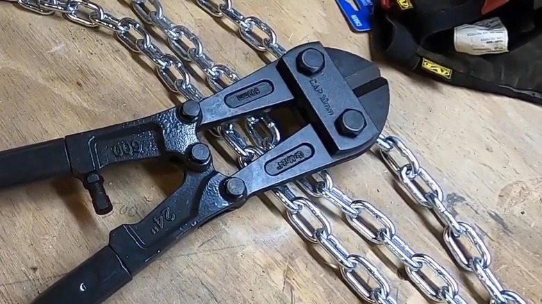 Bolt cutters near a large chain