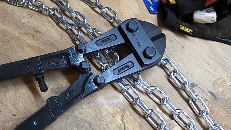 Bolt cutters near a large chain