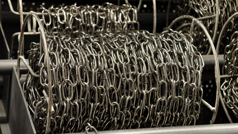 Thick metal chain on a spool at a hardware store