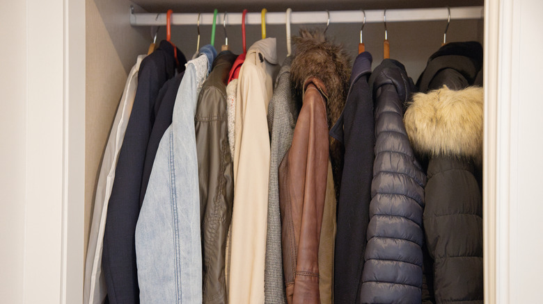 Jackets and coats hanging in a closet