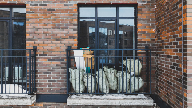 Close up of bags of trash on balcony