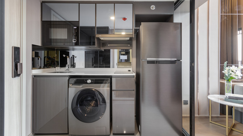 Modern simple small kitchen appliance corner in the grey and white kitchen