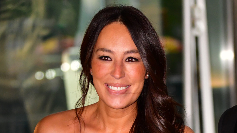 Joanna Gaines smiling with partial updo