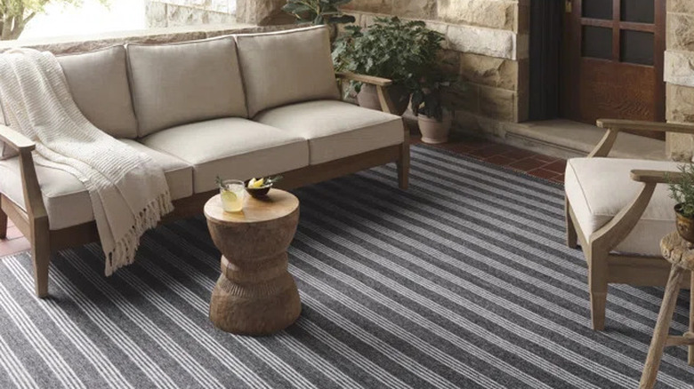 Striped rug under patio furniture