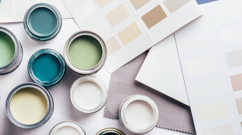 open paint cans and color swatches