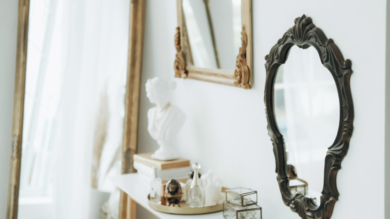 A luxurious room decked with ornate mirrors.