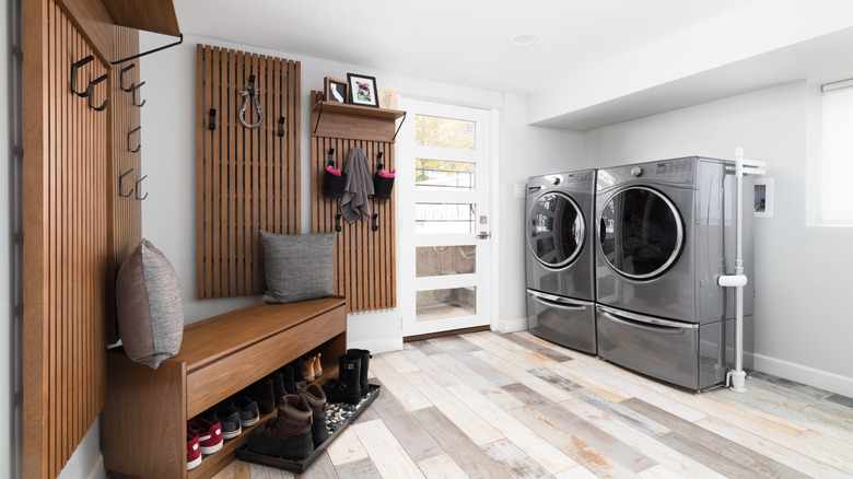 Modern mudroom with wood panels