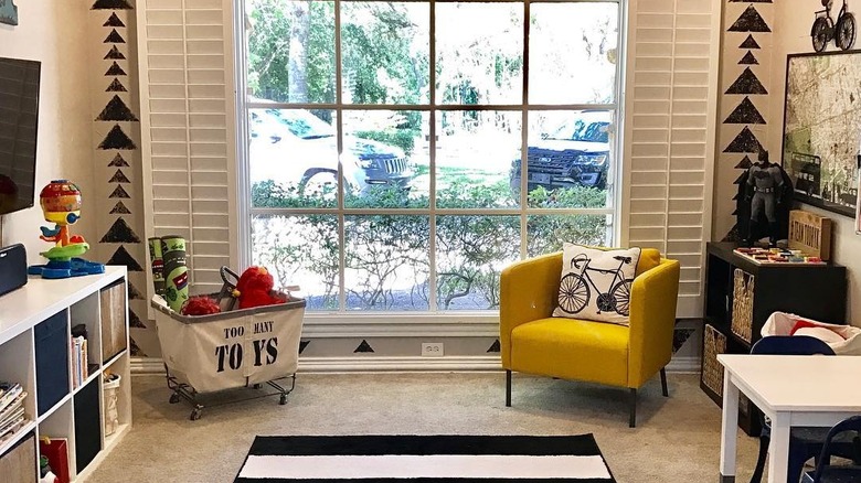 Jenn Todryk's playroom with a yellow IKEA armchair