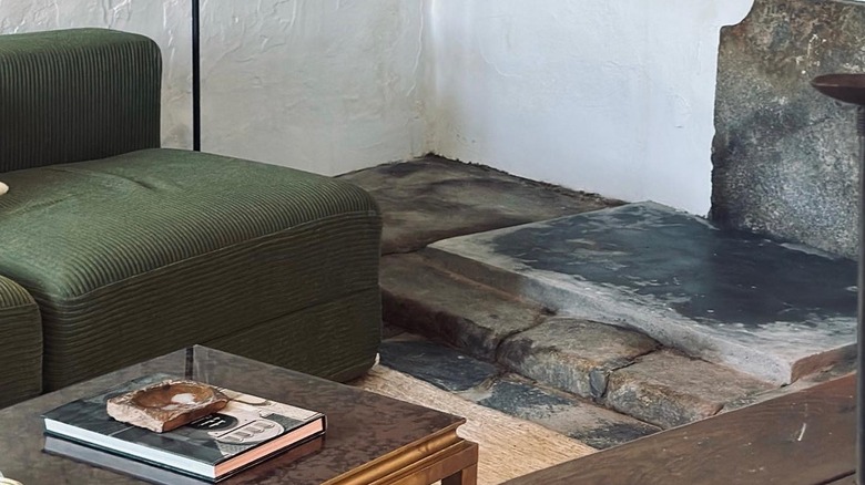 A green couch in Jeremiah Brent's living room