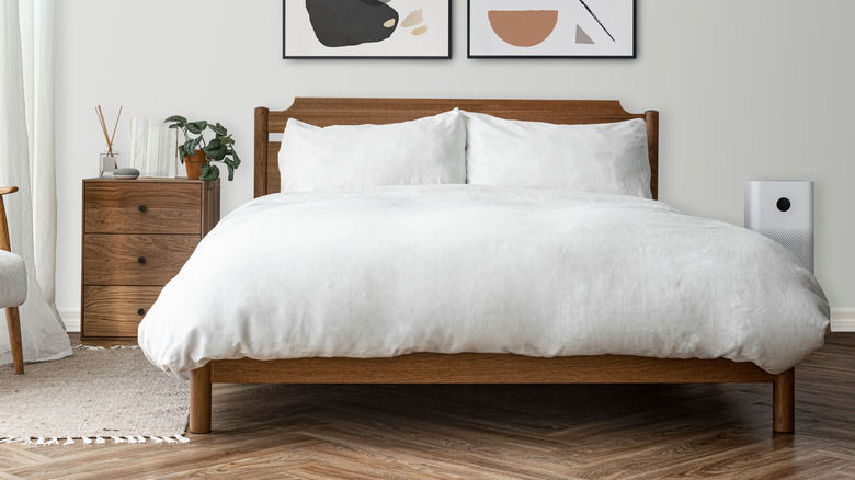 wood bed with white bedding