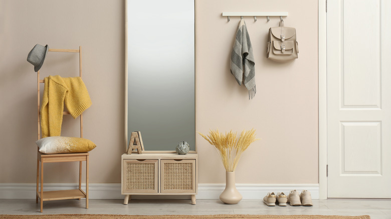 entryway with bench and shoes