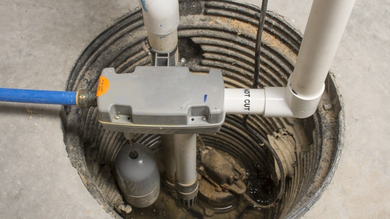 A submersible sump pump in a sump basin