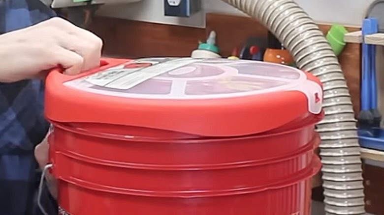 Close up of the Bucket Boss bucket organizer and seat on a 5-gallon bucket